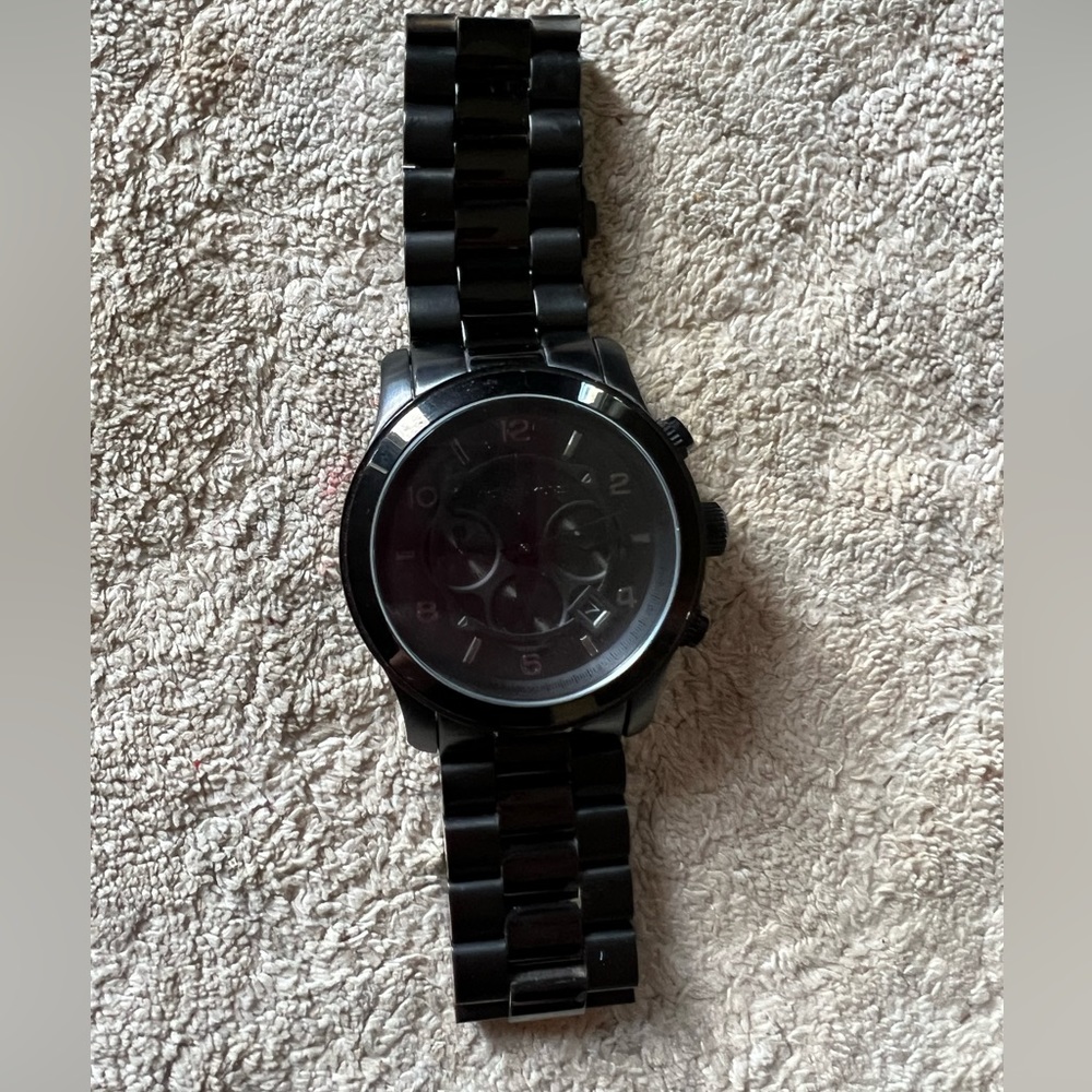 Michael Kors watch. Small scratch on front glass and needs new battery.
